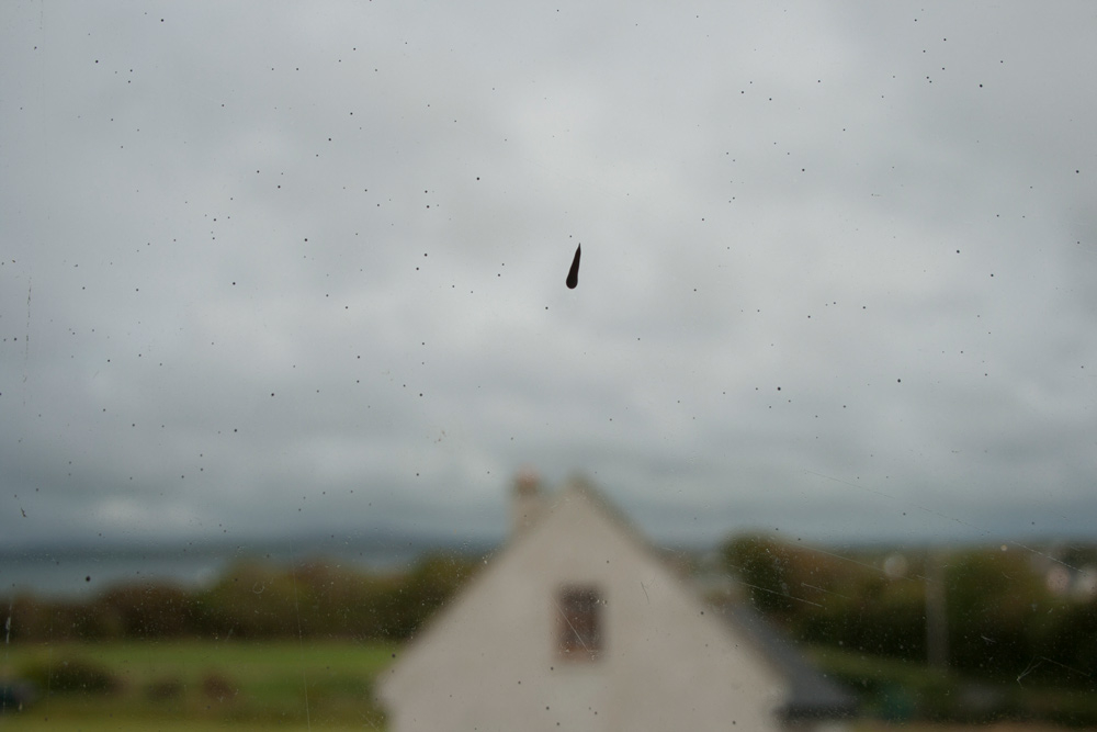 Black rain on a house